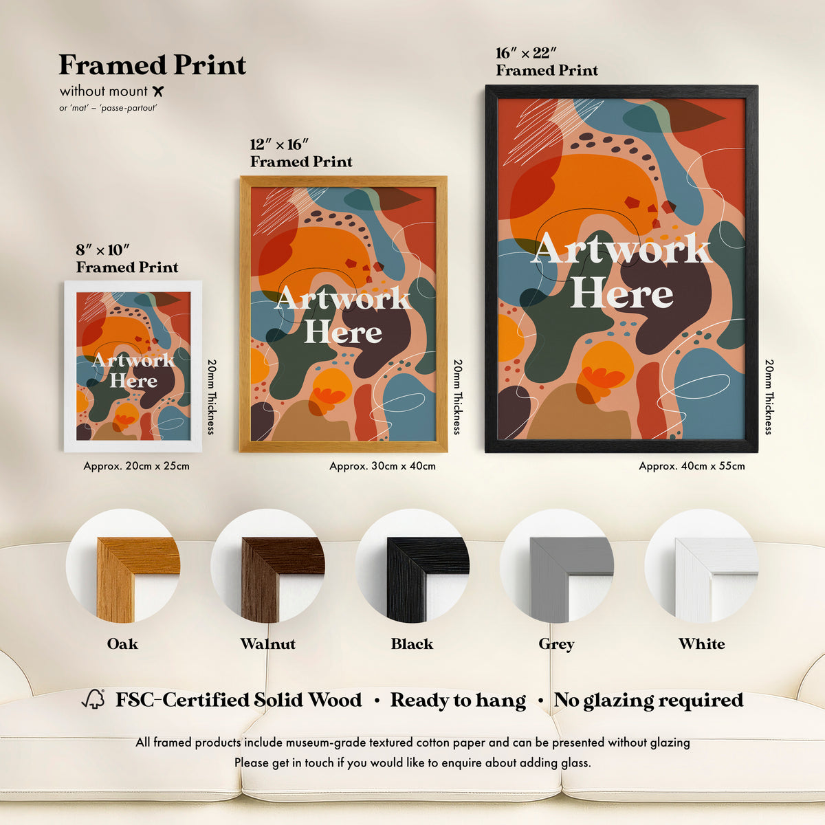 a living room with a white couch and a poster on the wall