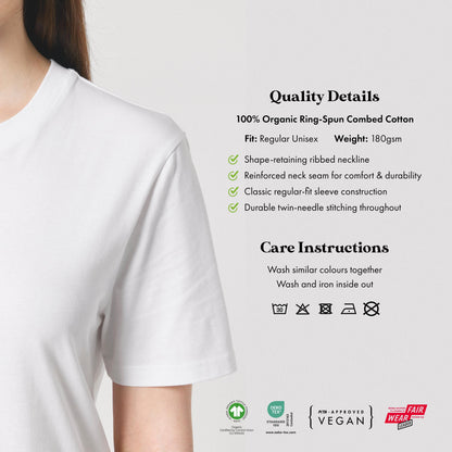 a close-up of a person wearing a white t-shirt, with a focus on the t-shirt's details and care instructions.