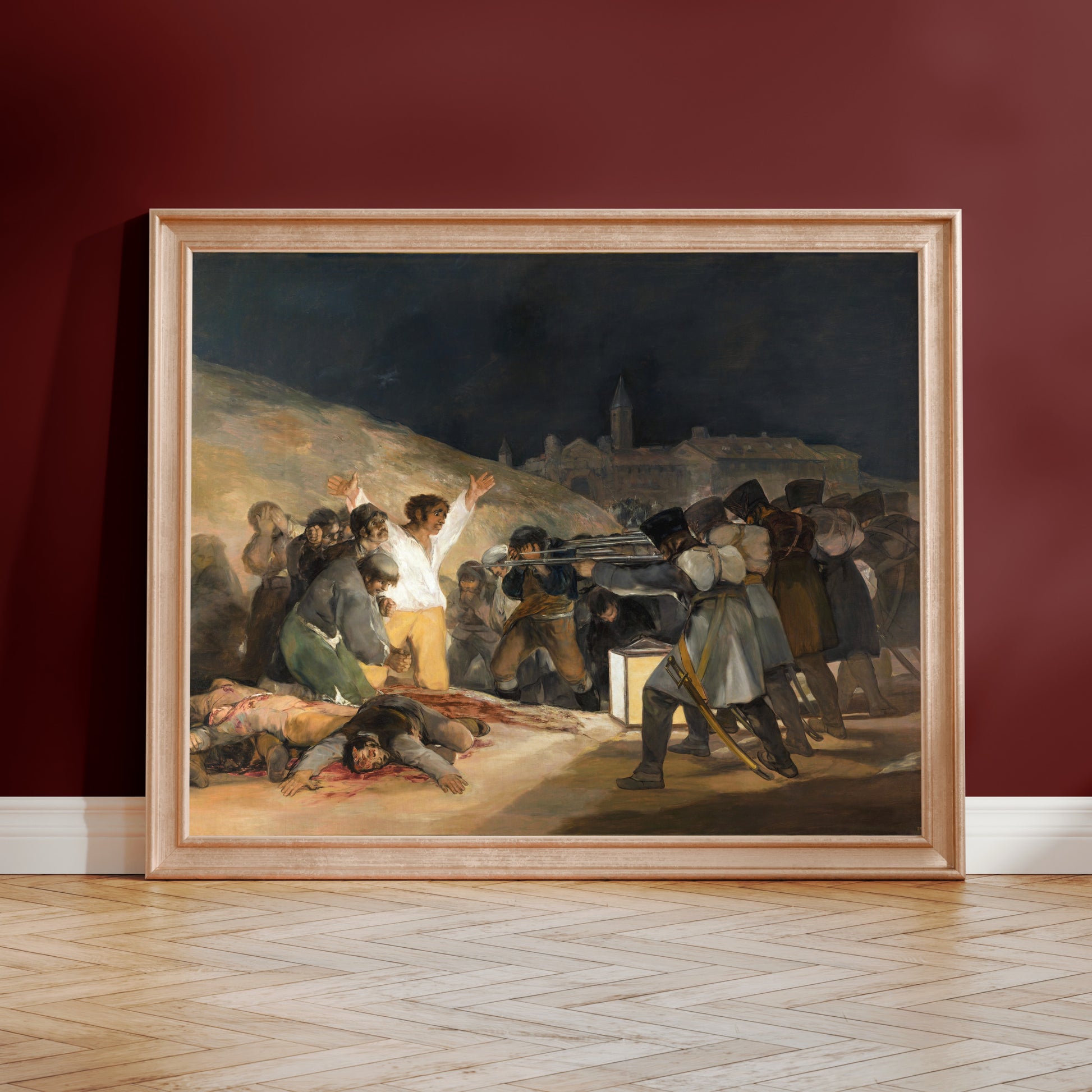 The image is a framed painting depicting a group of people gathered around a fire, with some individuals holding a knife.