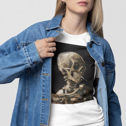A woman wearing a denim jacket and a white t-shirt with a skull design on it.