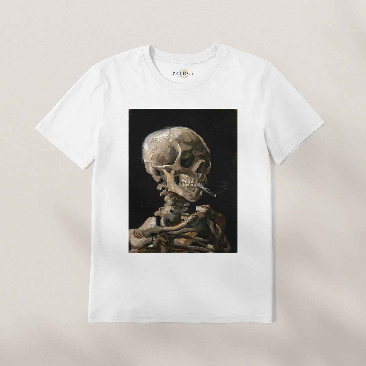 A white t-shirt with a framed image of a skeleton smoking a cigarette.