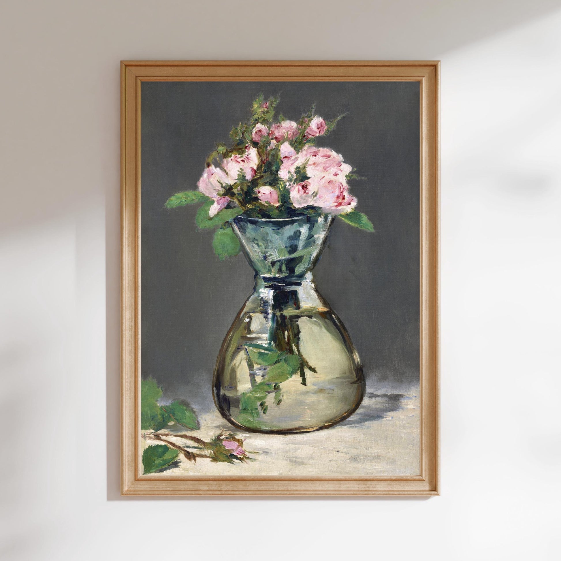 A framed painting depicting a vase filled with pink flowers against a dark background.