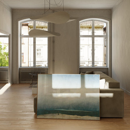 a spacious living room with large windows, a comfortable sofa, and a large painting on the floor.