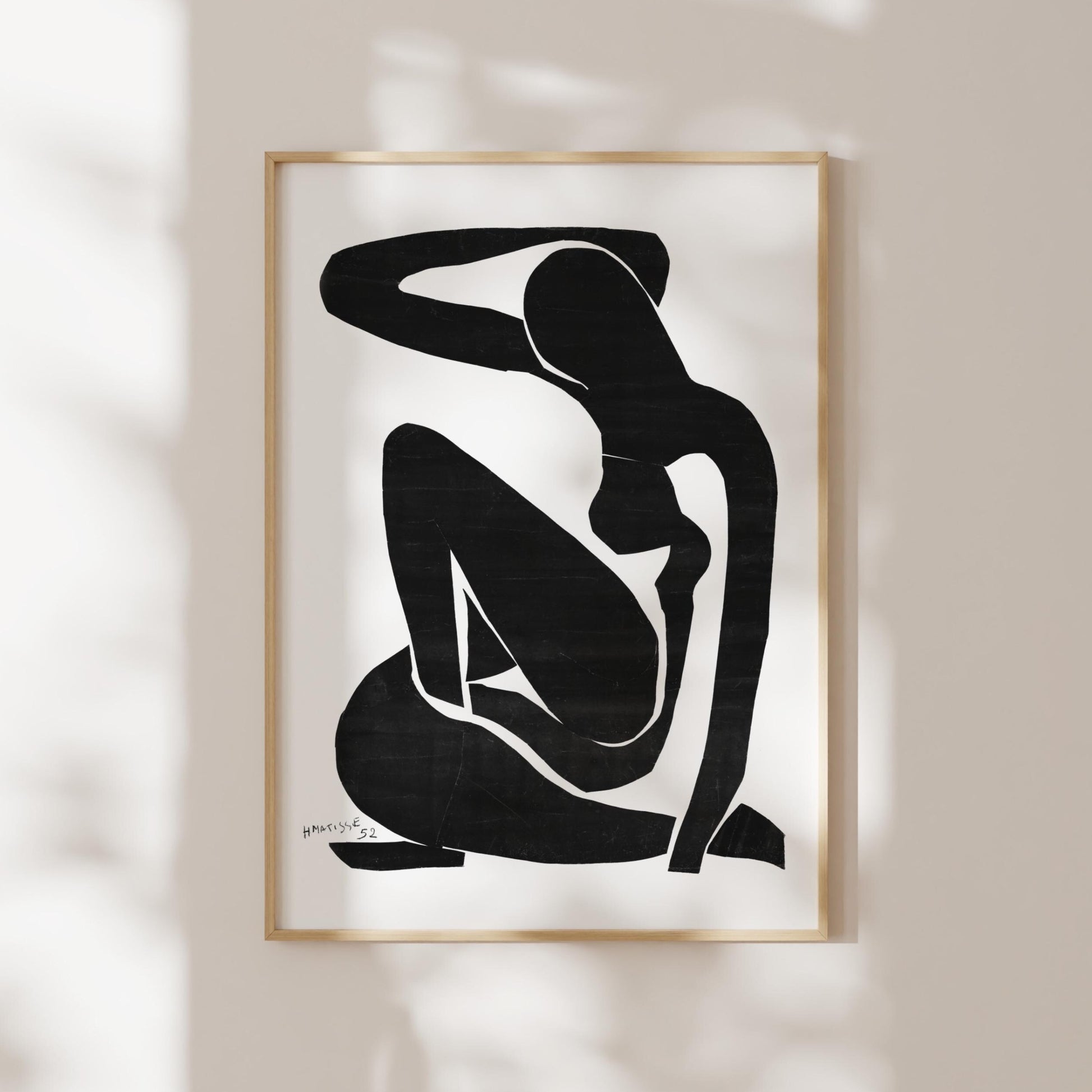 a black and white abstract art piece depicting a seated figure with a minimalist, geometric style.