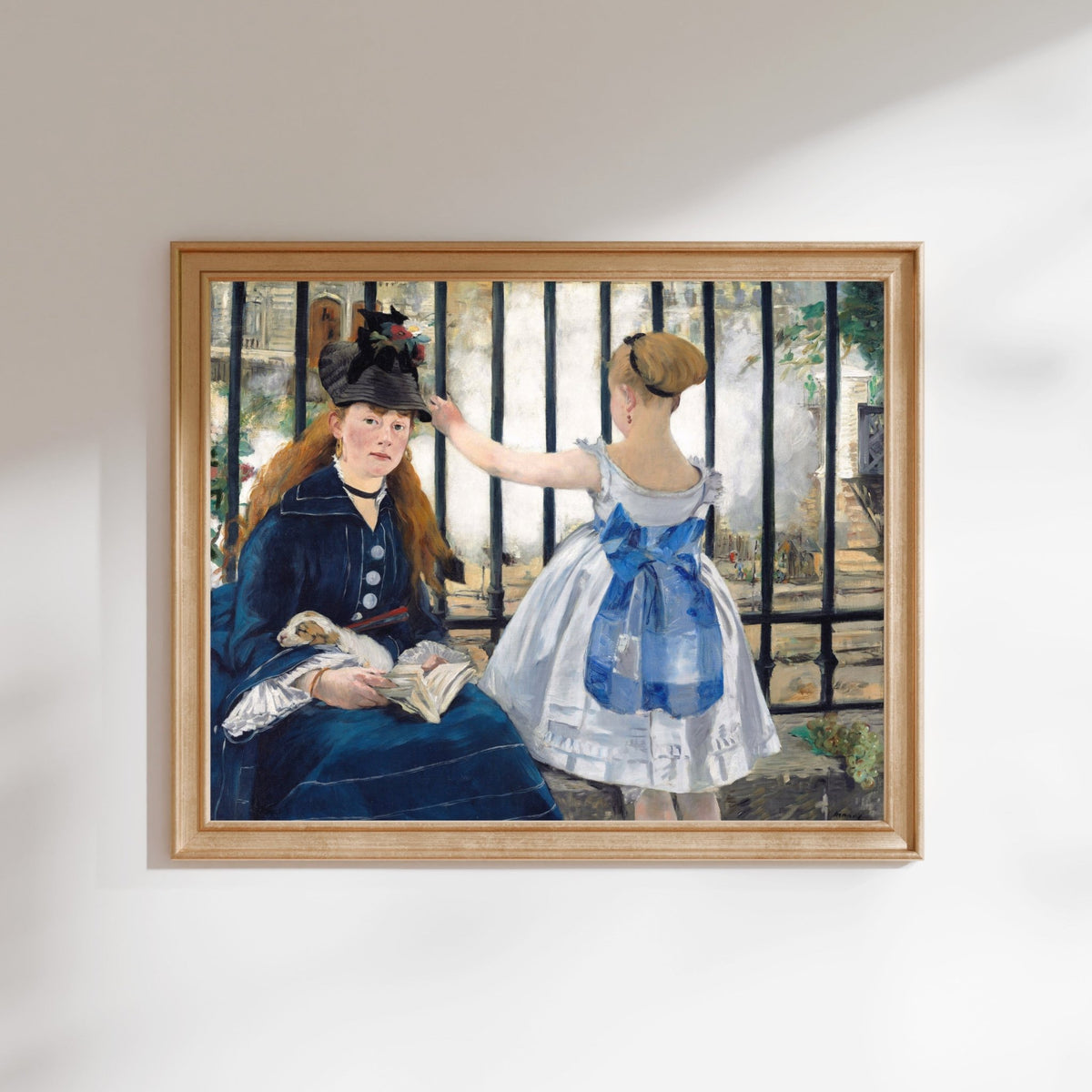 The image is a framed painting depicting two women in Victorian-era clothing, with one woman sitting and the other standing behind a fence.