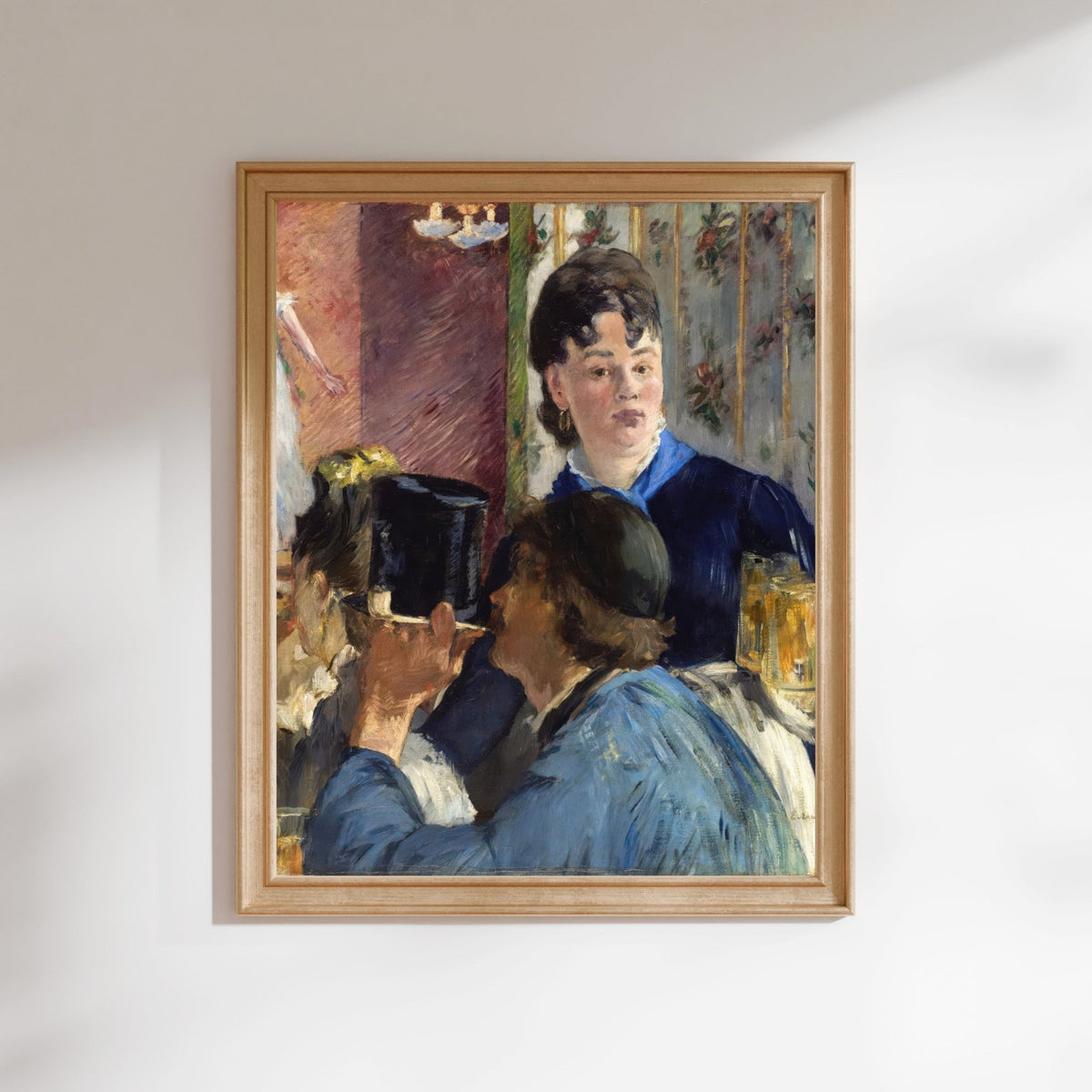 The image is a framed painting depicting two women in a room, with one woman wearing a blue dress and the other wearing a black dress.