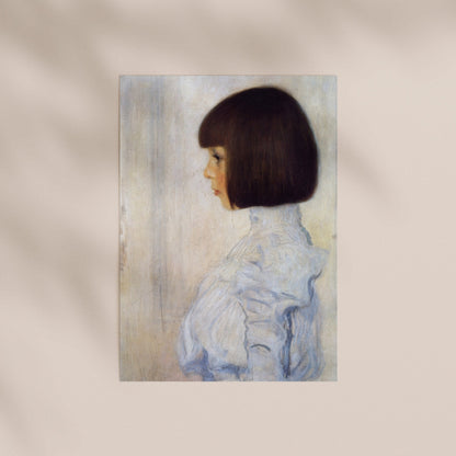 A portrait of a young woman with short dark hair wearing a white blouse.