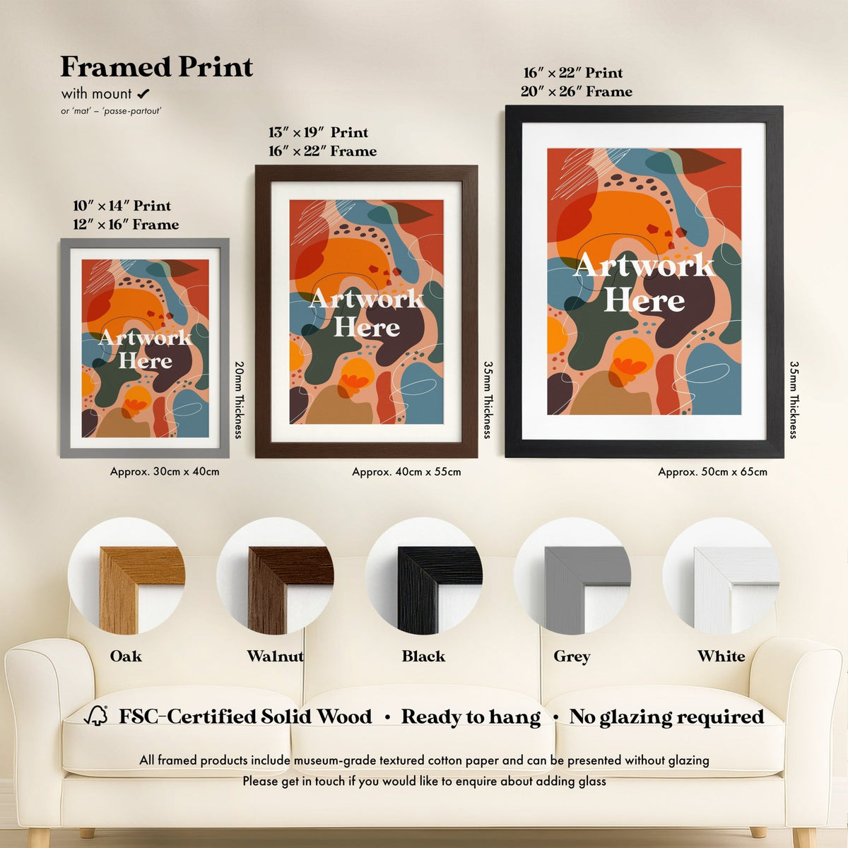 three framed prints of abstract art, each with different frame colors and sizes, along with a section of a couch and a chair.