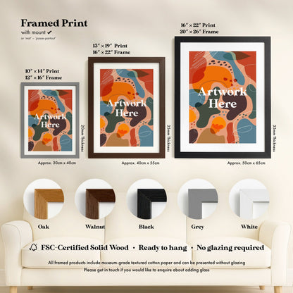 three framed prints of abstract art, each with different frame colors and sizes, along with a section of a couch and a chair.